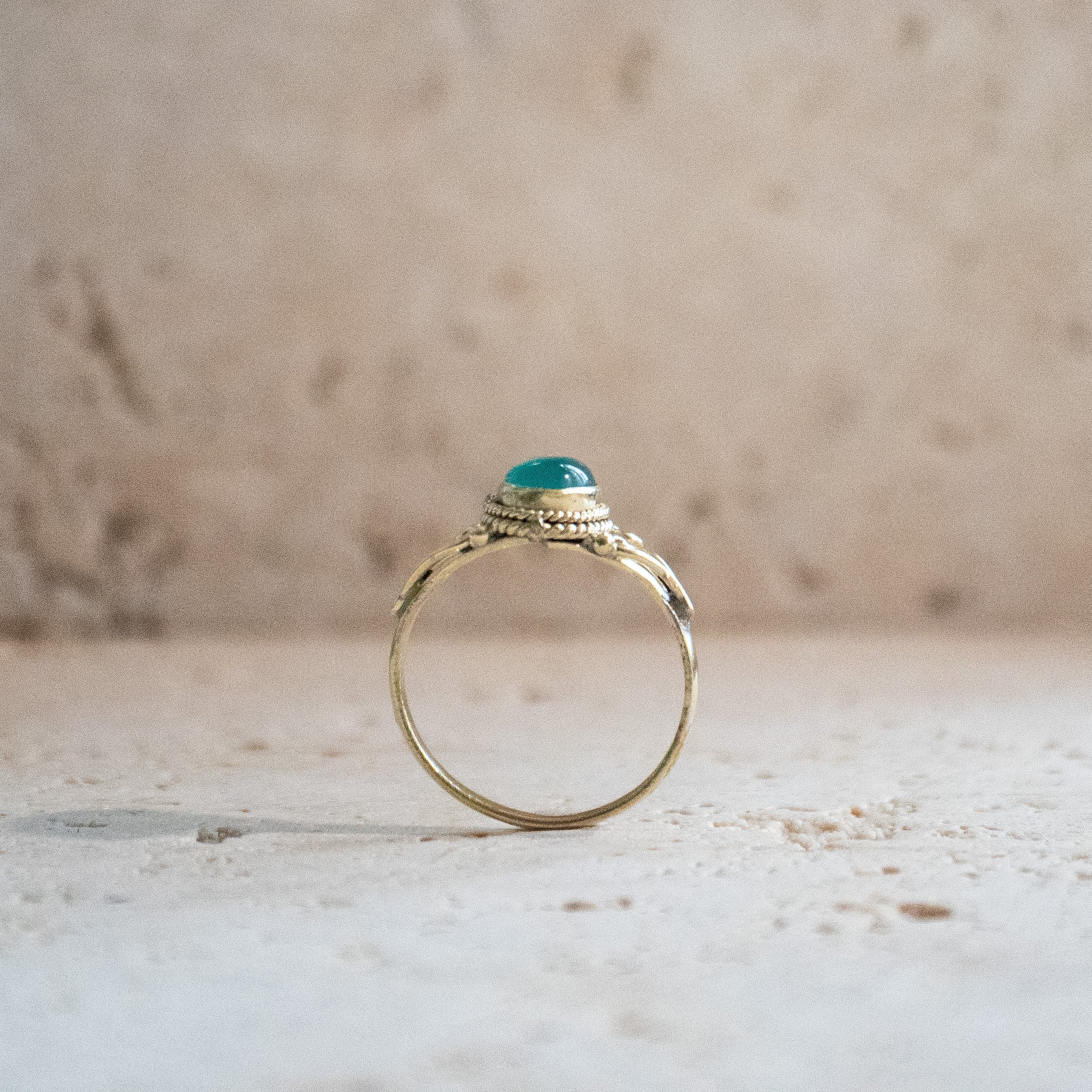 Green onyx ring with oval stone playfully handmade in gold