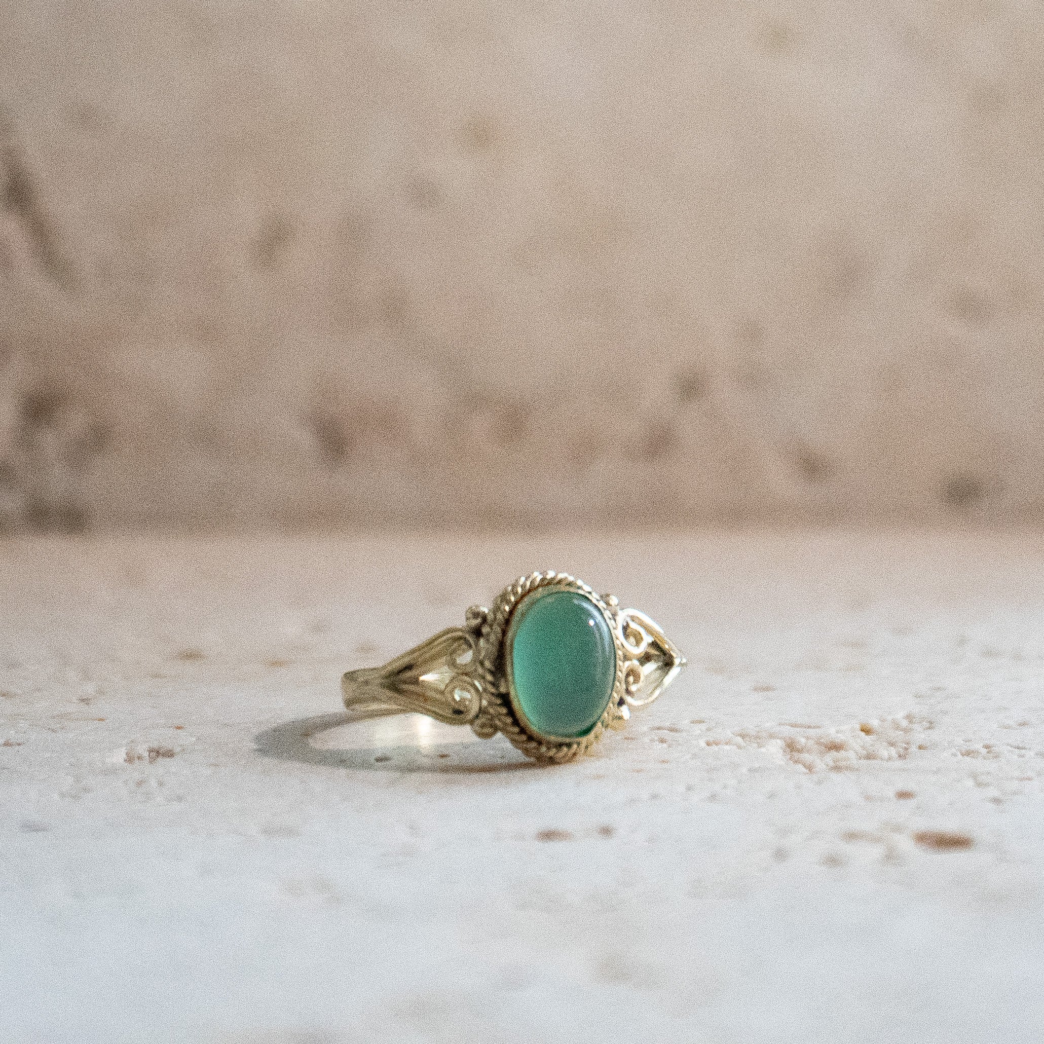 Green onyx ring with oval stone playfully handmade in gold