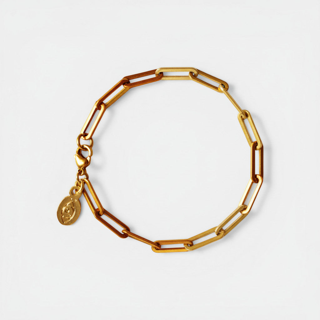 Nooe UG gold-plated stainless steel paperclip link bracelet with charm. Modern, minimalist, and elegant design.