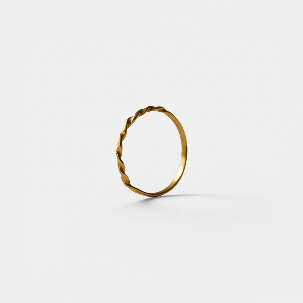 Nooe UG fine twisted brass ring in gold tone, handmade, nickel-free, perfect for stacking.