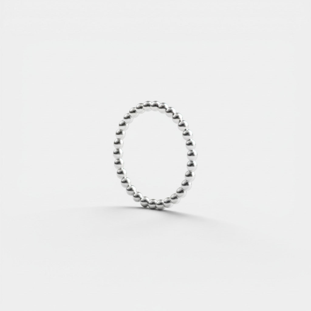 Nooe UG handmade 925 sterling silver stacking ring with small, textured balls.