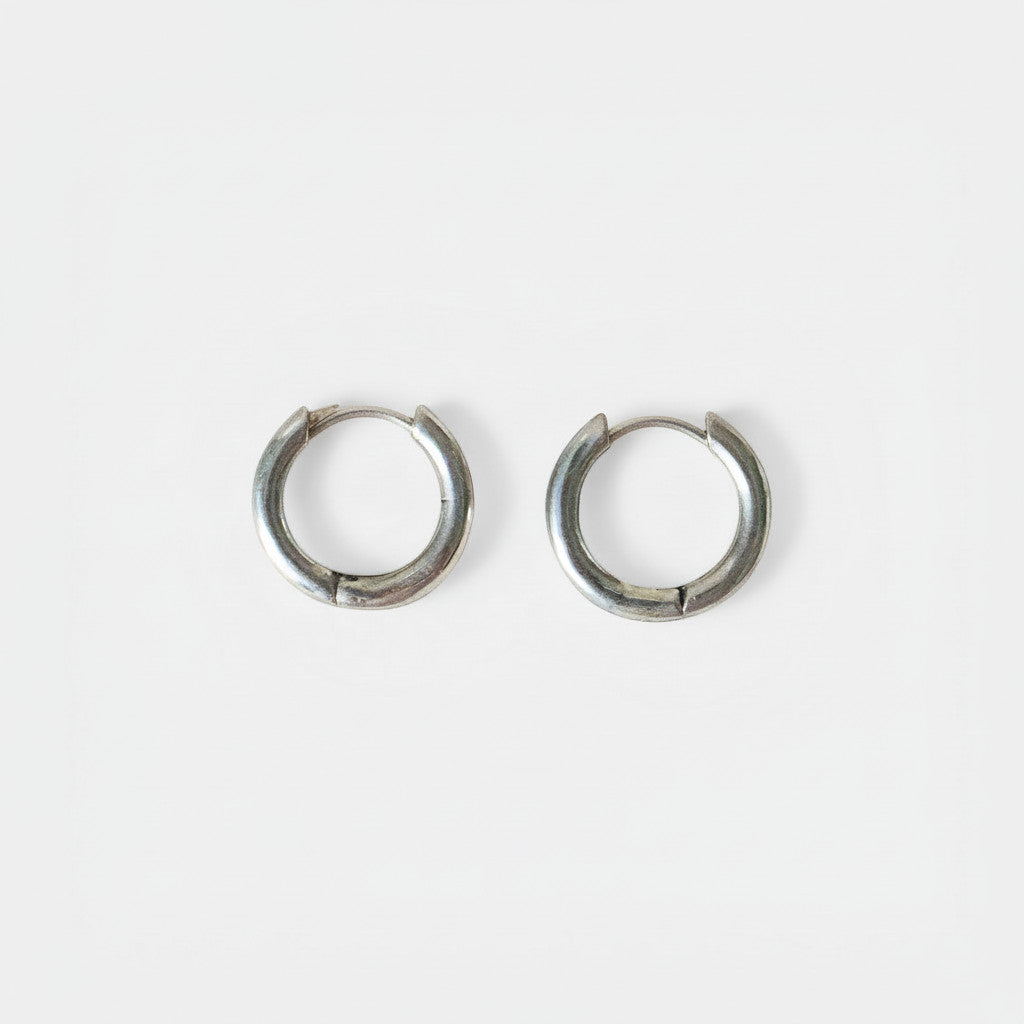 Nooe UG handmade small sterling silver huggie hoop earrings, minimalist and hypoallergenic.