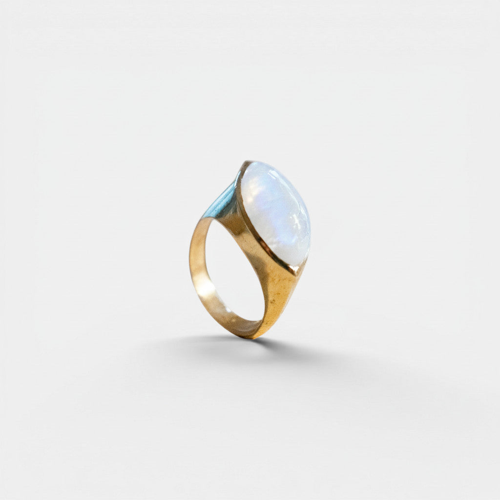 Nooe UG gold-tone brass ring with an oval, white moonstone in an eye-shaped setting.