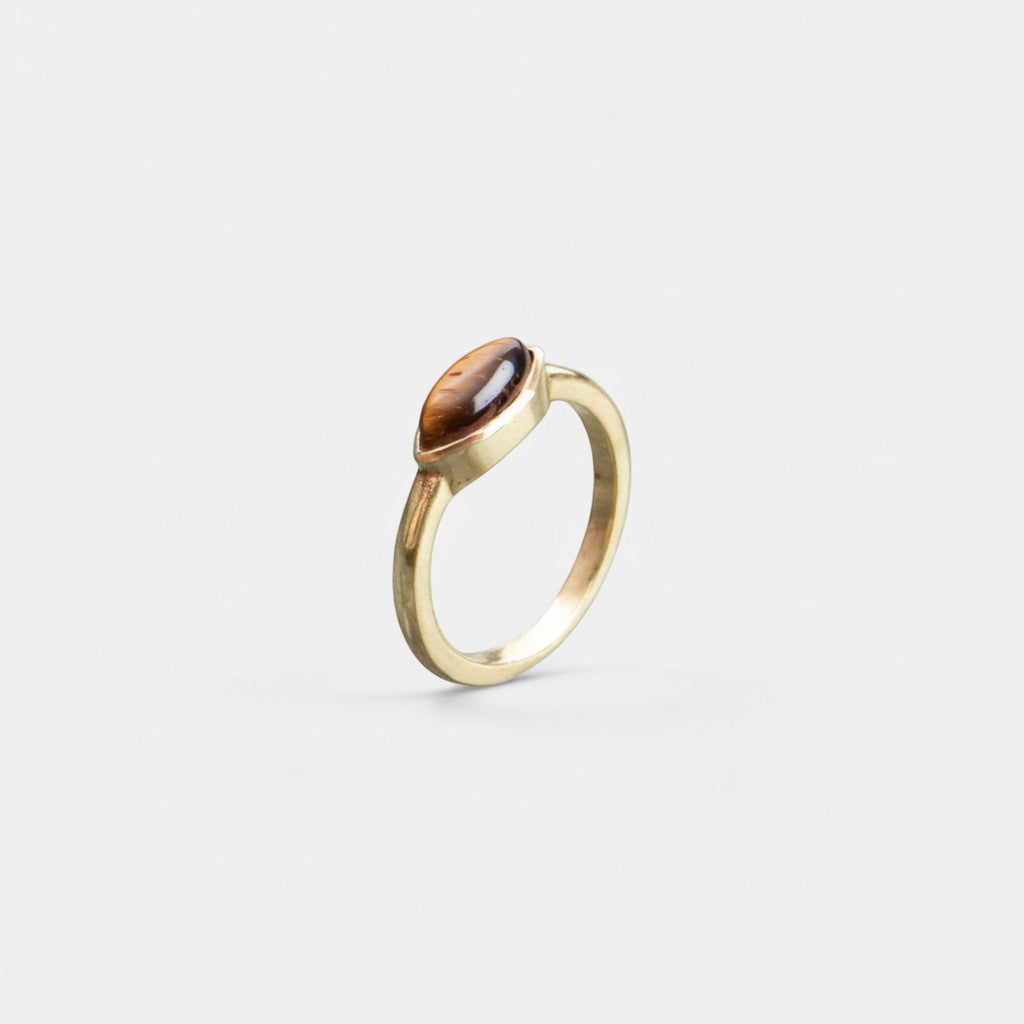 Nooe UG handmade gold ring with oval tiger eye stone, brass setting.